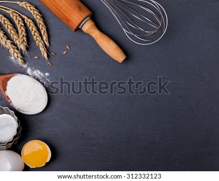 Baking tools on the black board, top view