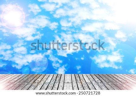 wood texture floor with  sunshine sky and cloud