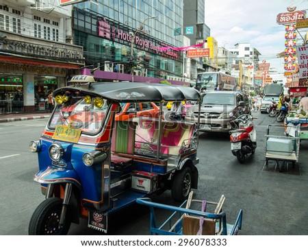 CHINA TOWN,BANGKOK, THAILAND - JULY 12:Unidentified male driver of Tuk Tuk or 3-wheeled taxi,waiting passenger to trips tour at china town on July 12 2015