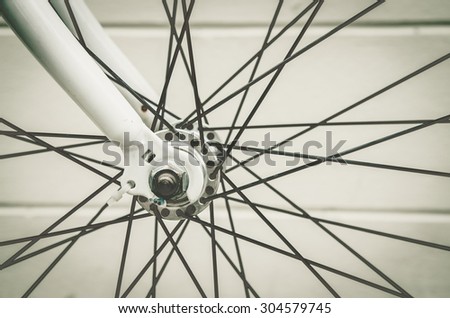 close up of bicycle wheels process in vintage retro style
