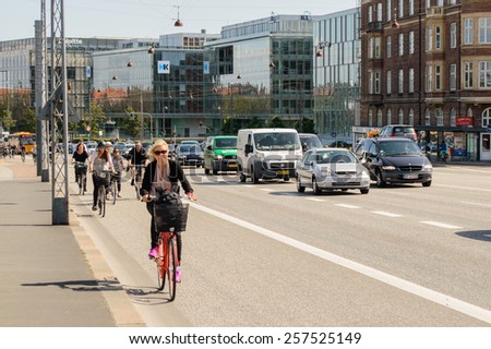 COPENHAGEN, DENMARK - AUGUST 12: People ride bikes on August 12, 2014 in Copenhagen.