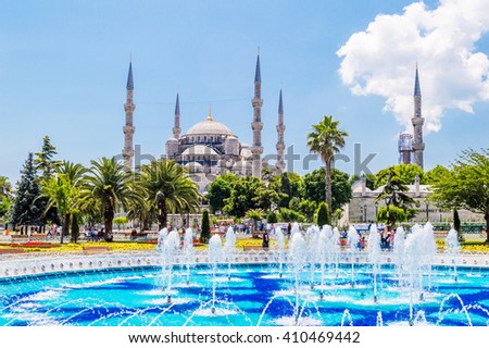 The Sultan Ahmed Mosque (Blue Mosque) and fountain view from the Sultanahmet Park in Istanbul, Turkey
