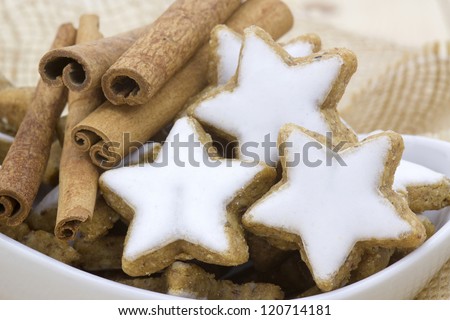 typical christmas cinnamon star cookies and cinnamon sticks