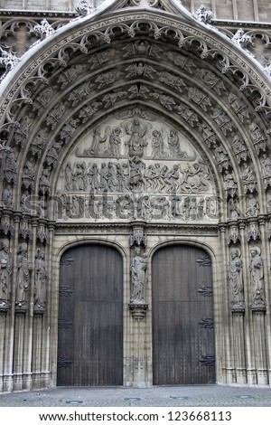 Bronze door entry to famous Vrouwekathedraal - Cathedral of our Lady in Antwerp