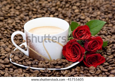 cup of coffee and red roses
