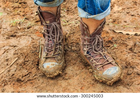 muddy feet-shoes - walking through the mud.