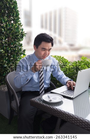 Business man with a laptop and drink coffee