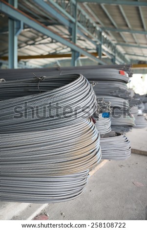 Steel rods or bars used to reinforce concrete, in warehouse