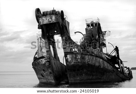 Black and white ship wreck - formally a dredge.