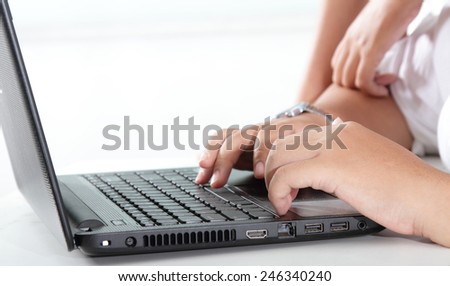 hand on laptop keyboard