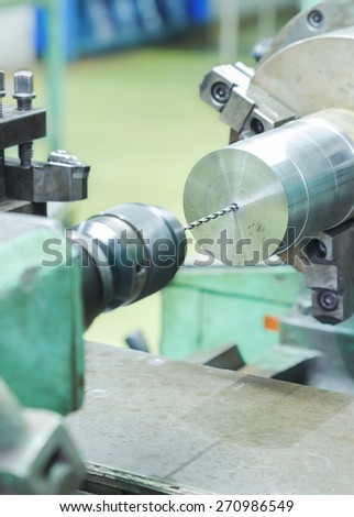 Drilling and turning metal by turning and lathe machine