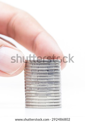 Money coins pile isolate on white background,hand putting on money coin