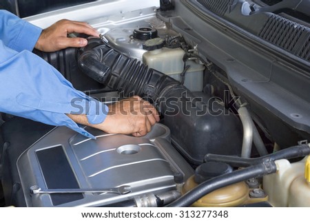 Car repair service, Auto mechanic repairing car engine