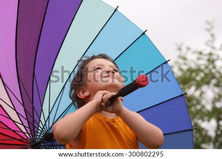 Rainbow umbrella with a boy