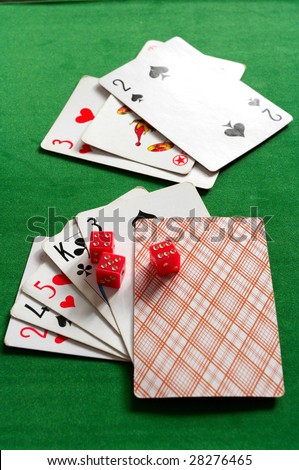 cards and joker on the  green  background