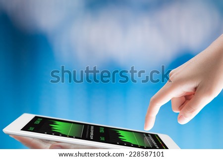 hand hold and tap on digital tablet