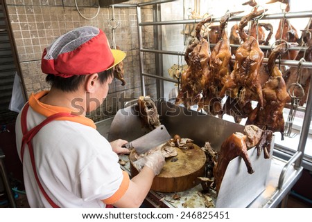 BANGKOK, THAILAND- JAN 20:Chef chops roast duck at chinese restaurant in chinatown on JANUARY 20, 2015. As chinese new year is coming in a few weeks ,increase demand on roast duck as the sacrifice.