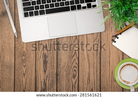 office desk top view on timber wood background
