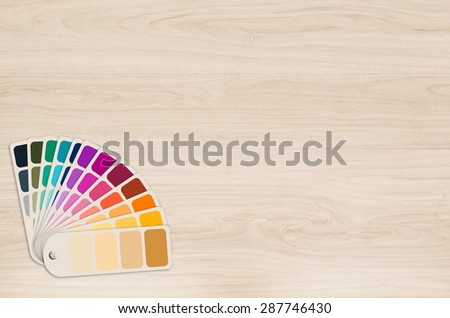 color swatch paper on wooden background