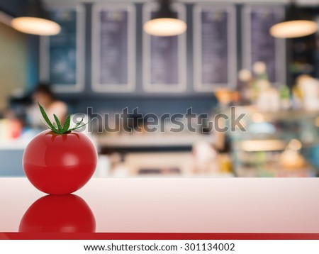 tomato on counter with bakery shop blurred background