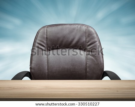 wooden table with office chair one blue abstract background