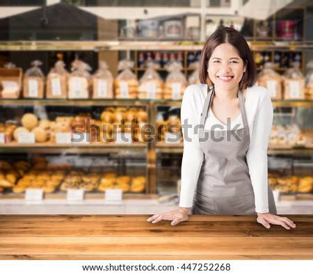 business owner with bakery shop background
