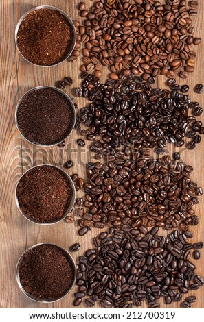 Overhead view of four varieties of fresh roasted coffee Beans