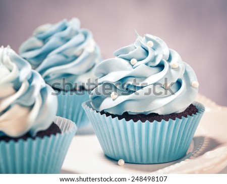 Blue Cupcakes on a plate. Vintage style.
