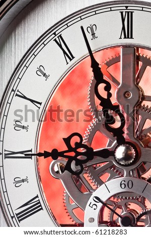 Close up of a Clock Showing Gears. Time is almost Nine-o-clock.