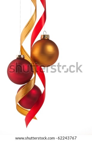 Traditional red and gold Christmas ball ornaments with ribbons on white