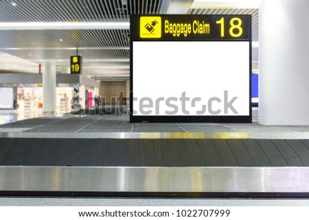 Blank billboard on Baggage claim area in the airport,Empty Baggage conveyor belt at the airport