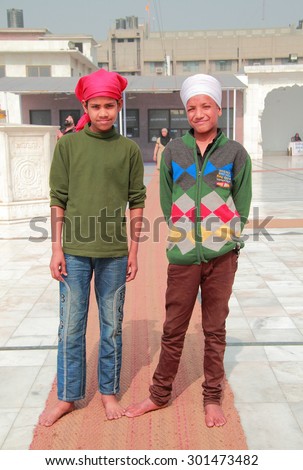DELHI, INDIA - FEBRUARY 20, 2015: indian children from poor families look somewhere