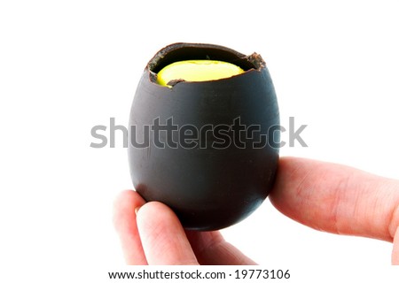 An Isolated to White photo of a mini Easter Egg with toy inside