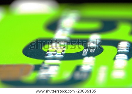 A macro shot of a bright green credit card