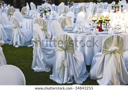stock photo Wedding Chairs and covers at an outdoor wedding