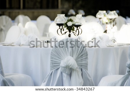 stock photo A photo of empty wedding chairs and tables elegantly decorated