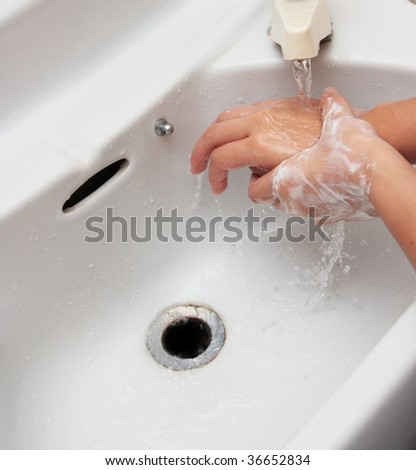 Washing soaped hands with water, part of the steps to prevent spread of influenza