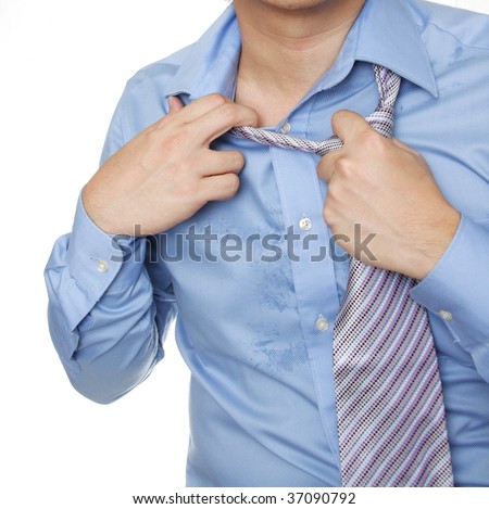 Man taking off neck tie