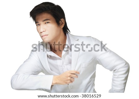 Portrait of handsome Chinese man dressed formally in all white attire, shirt and jacket.