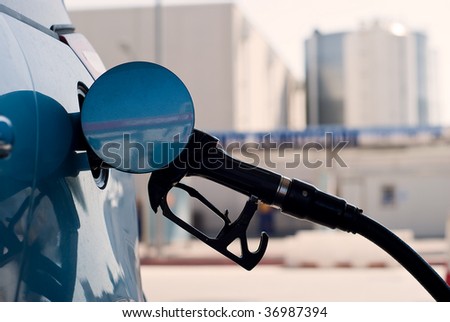 Close putting gasoline in a gas station