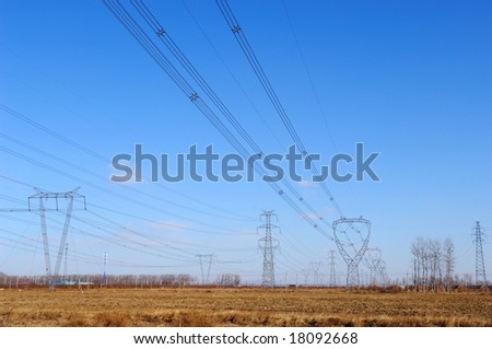Many high tension lines, many kind towers and lines in the blue sky