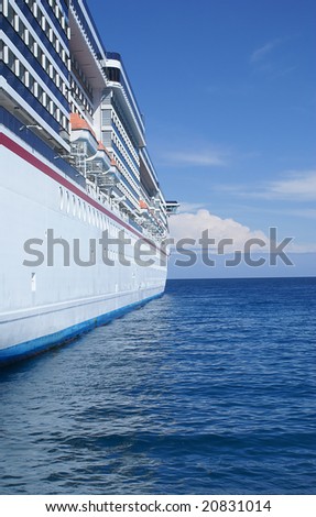 Cruise ship on a bright sunny day at sea.