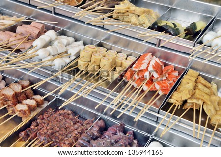 Raw food on skewers in asian market, Penang, Malaysia