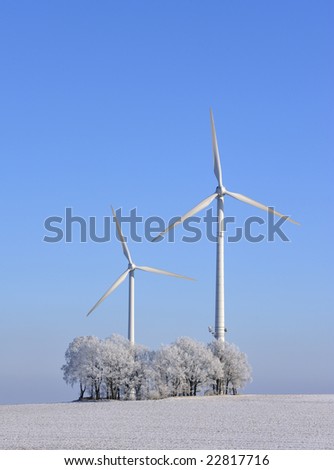 Wind turbines and trees in winter, Saxony, Germany