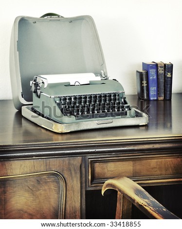 Old typewriter on writing desk, with retro look