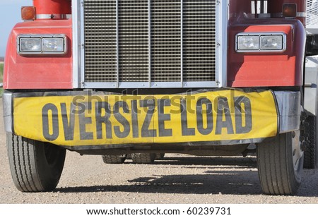 Closeup of oversize load sign on front of truck