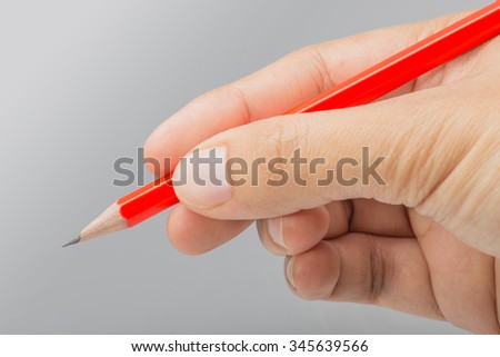 Hand Holding Sharp pencils close up