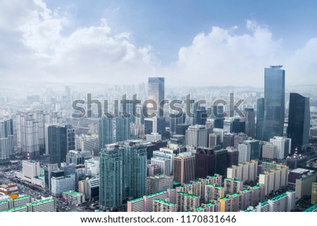 Seoul cityscapes, skyline, high rise office buildings and skyscrapers in Seoul city, winter daylight, top view in winter, Seoul, Republic of Korea, in mist winter season with blue sky and cloud