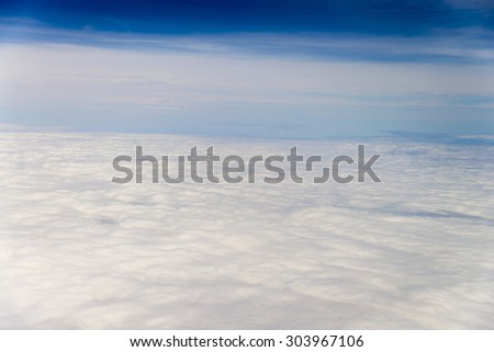 clouds sky, view from the window of an airplane flying in the clouds, top view clouds like an ocean