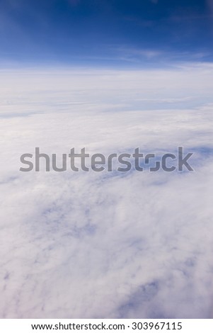 clouds sky,  view from the window of an airplane flying in the clouds, top view clouds like an ocean